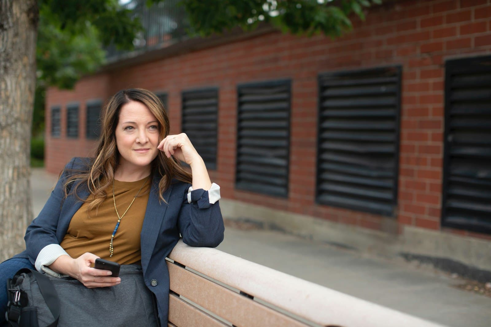 Professional holding a phone after a customer enquiry, representing warm WhatsApp leads from ads.
